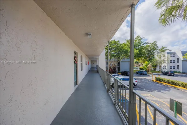 a view of a house with backyard and swimming pool