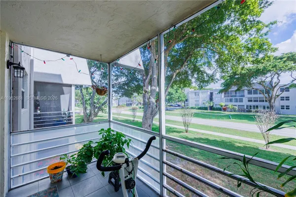 a view of a bench in the front of a house