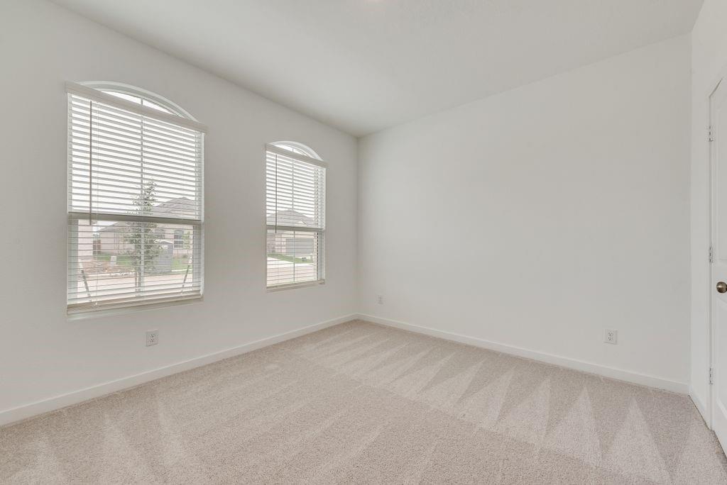 3009 Dutch Road Providence Village, TX 76227 - Photo 12 of 19 an empty room with windows