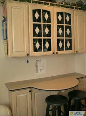 33 Meyer Road Edison, NJ 08817 - Photo 5 of 8 a view of a kitchen with a sink and cabinets