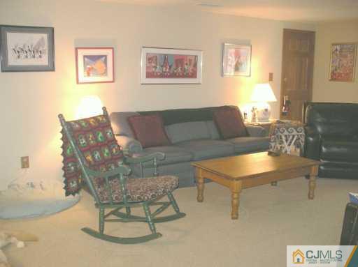 33 Meyer Road Edison, NJ 08817 - Photo 8 of 8 a living room with furniture and a table
