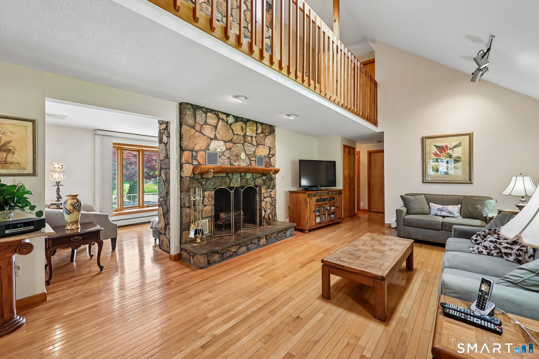 46 Stonegate Drive Wethersfield, CT 06109 - Photo 8 of 36 OPEN CONCEPT FAMILY ROOM- WITH VAULTED CEILING AND WOOD BURNING FIREPLACE