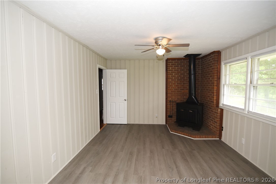 1673 Norment Road Lumberton, NC 28360 - Photo 5 of 32 wooden floor in an empty room with a window