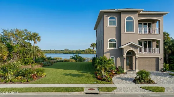 a front view of a house with yard