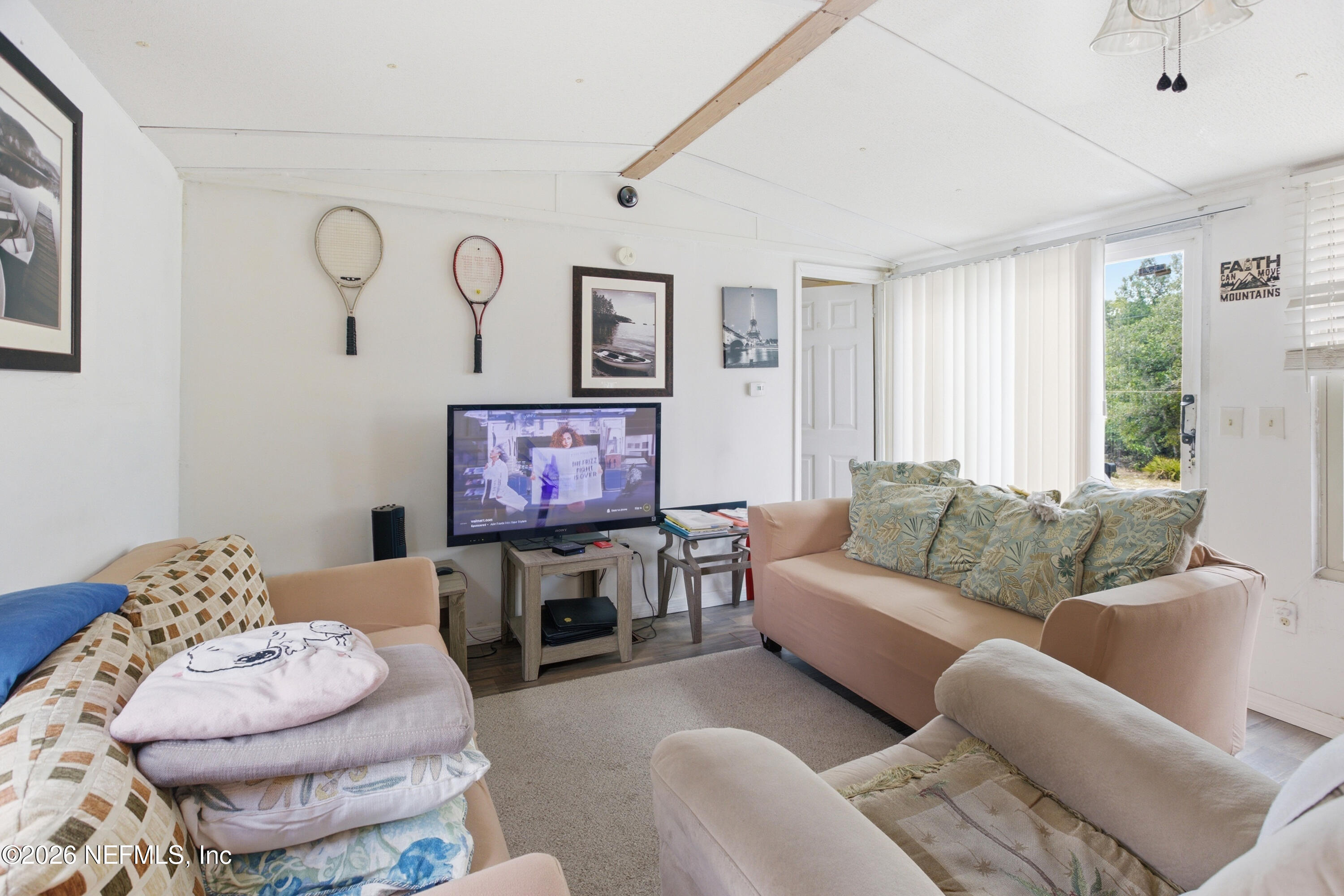116 London Avenue Interlachen, FL 32148 - Photo 6 of 25 a living room with furniture and a large window