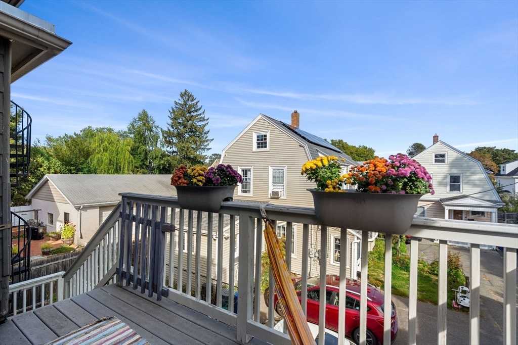189 Burrill Street, Unit 2 Swampscott, MA 01907 - Photo 12 of 21 a view of a chairs and table in the balcony