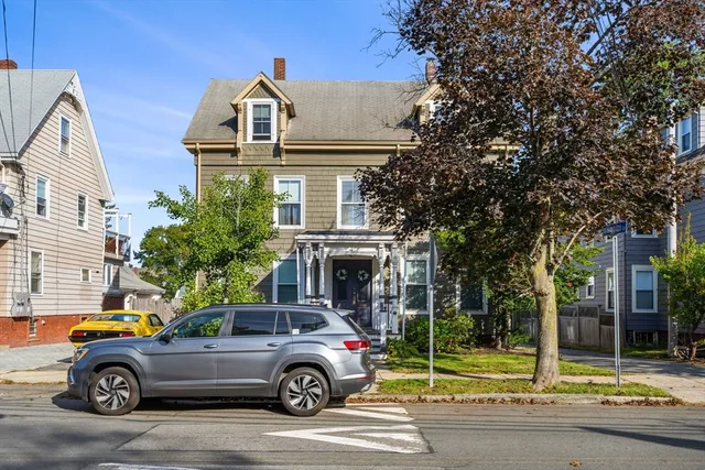 a car parked in front of a house