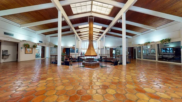 a view of swimming pool with seating space