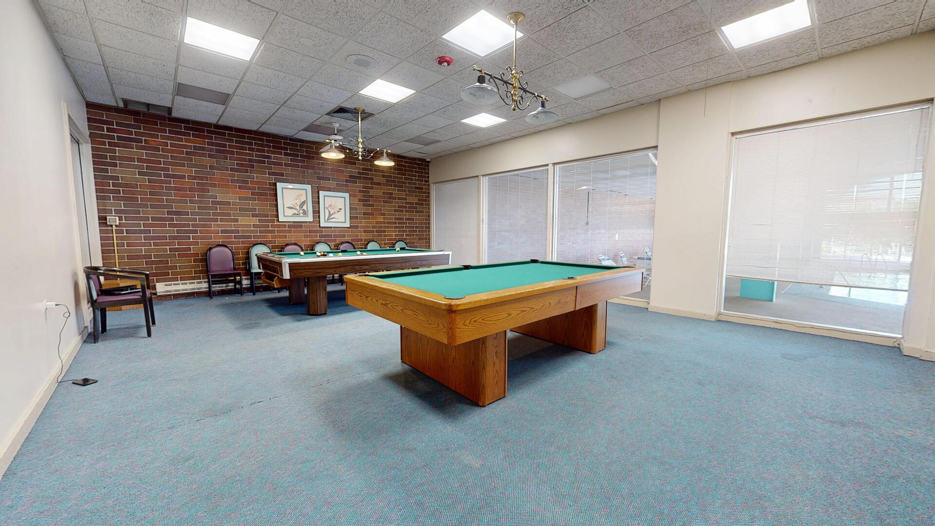 600 Naples Court, Unit 608 Glenview, IL 60025 - Photo 22 of 26 a room with pool table and windows