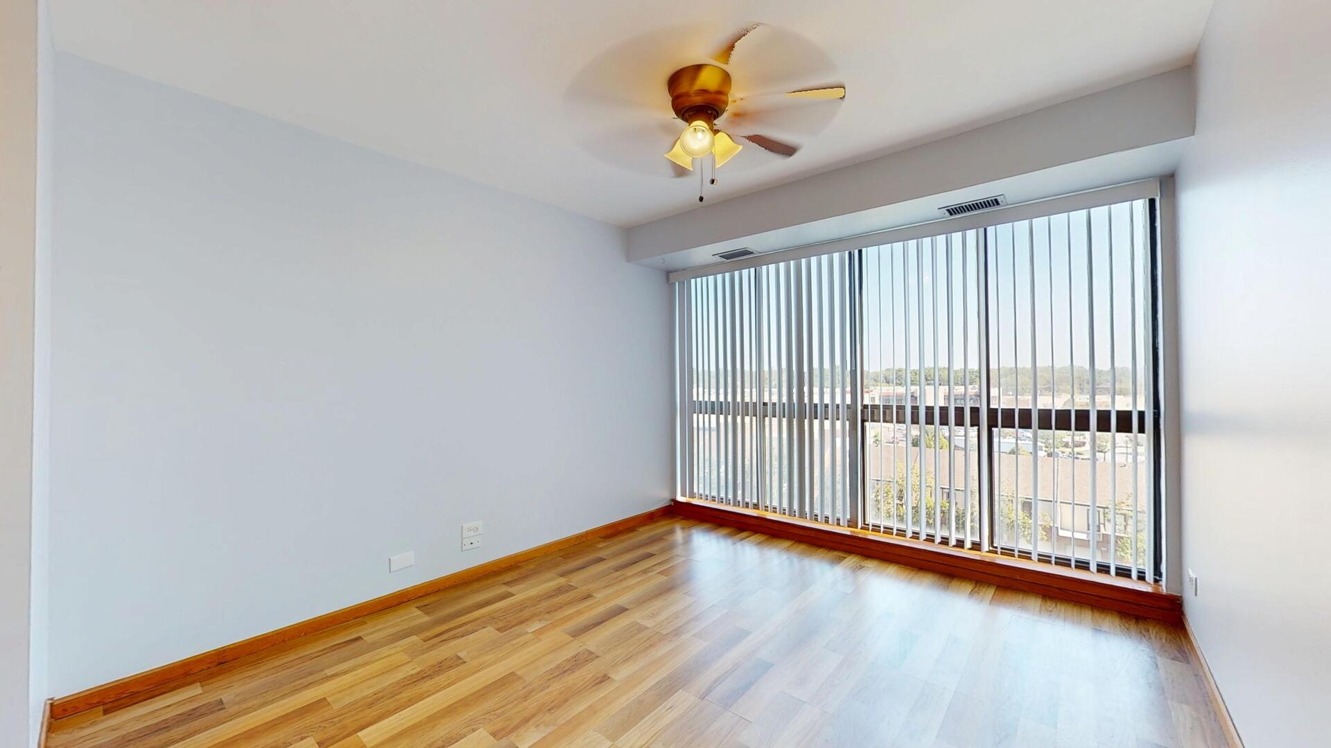 600 Naples Court, Unit 608 Glenview, IL 60025 - Photo 7 of 26 a view of room with wooden floor