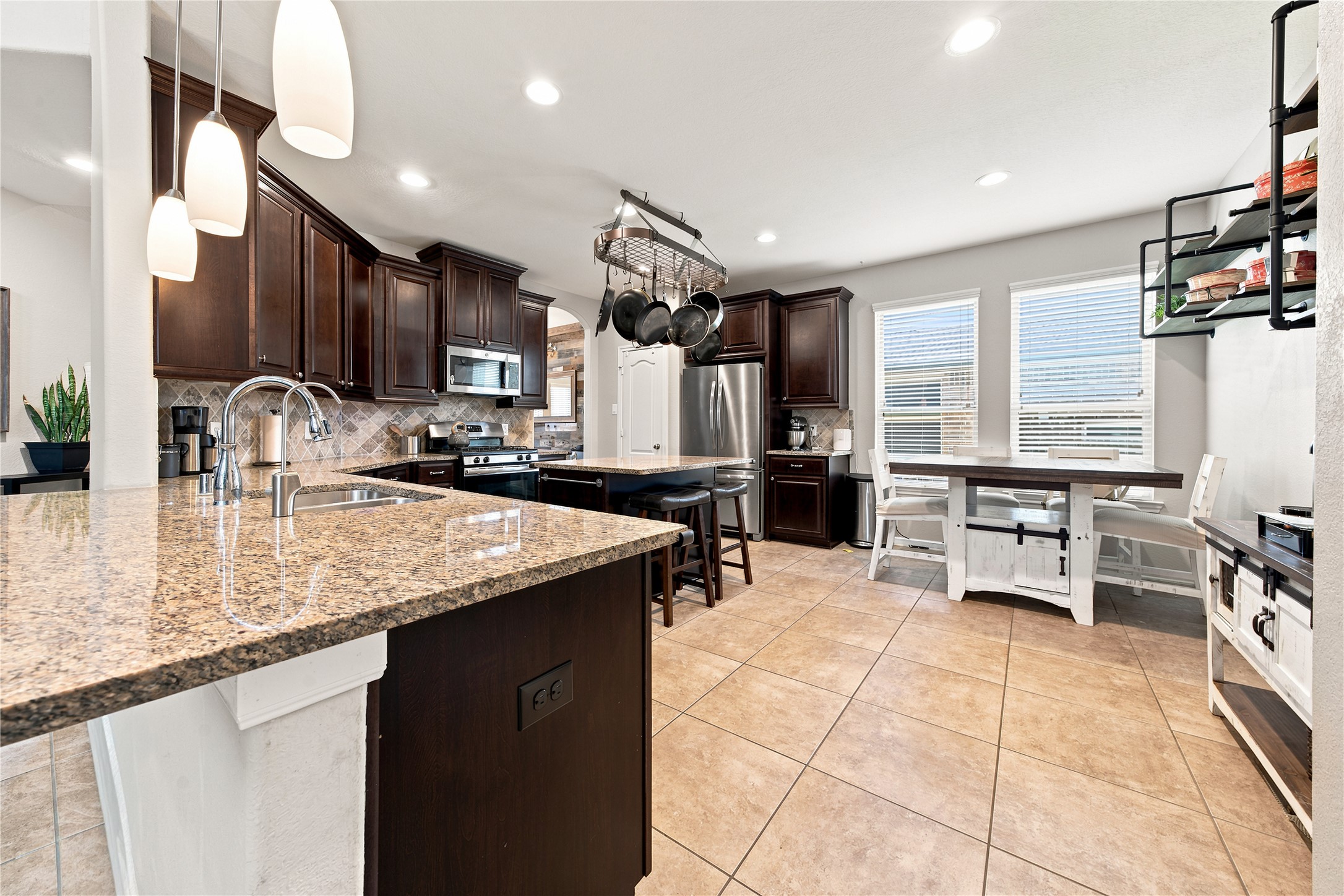 234 Dale Ridge Lane Dickinson, TX 77539 - Photo 13 of 31 Kitchen is open to the Family Room, complete with Breakfast area, center island, and pantry.
