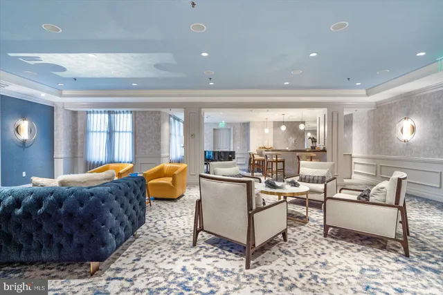 a living room with furniture and a rug