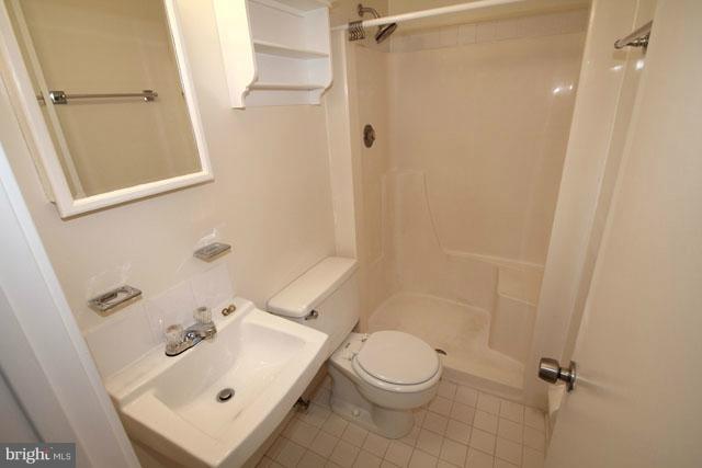 1105 North Rockingham Street Arlington, VA 22205 - Photo 11 of 24 a bathroom with a sink a toilet and shower