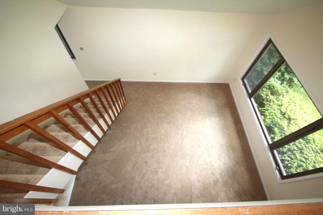 1105 North Rockingham Street Arlington, VA 22205 - Photo 24 of 24 a view of an empty room with wooden floor and windows
