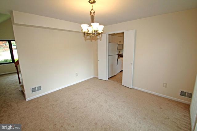 1105 North Rockingham Street Arlington, VA 22205 - Photo 9 of 24 a view of a chandelier in big room and chandelier