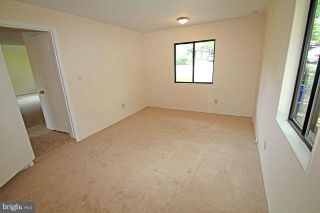 1105 North Rockingham Street Arlington, VA 22205 - Photo 10 of 24 an empty room with windows and entrance