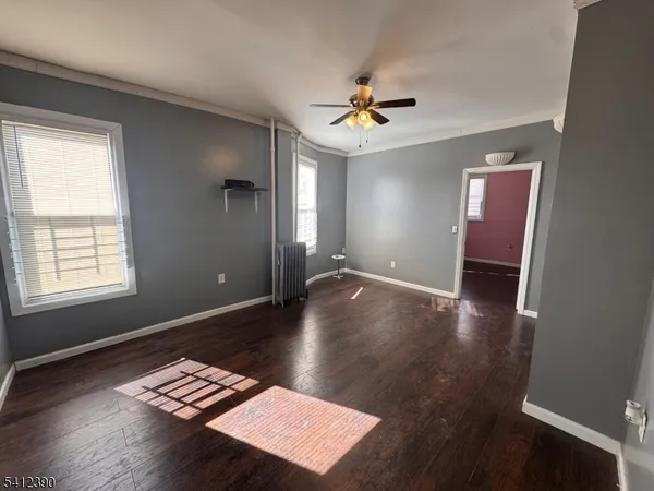 a view of workspace with wooden floor and window