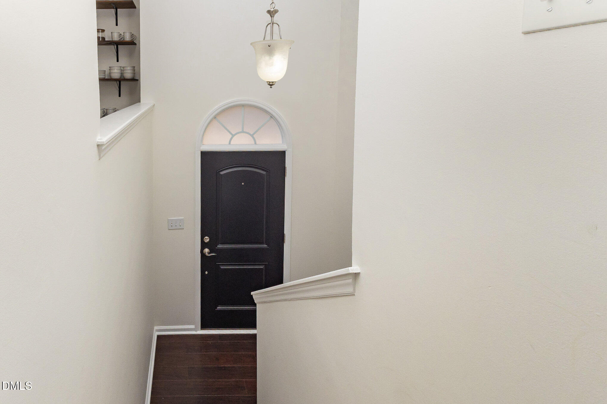 2211 Springhill Avenue Raleigh, NC 27603 - Photo 8 of 42 a view of a hallway with wooden floor and staircase