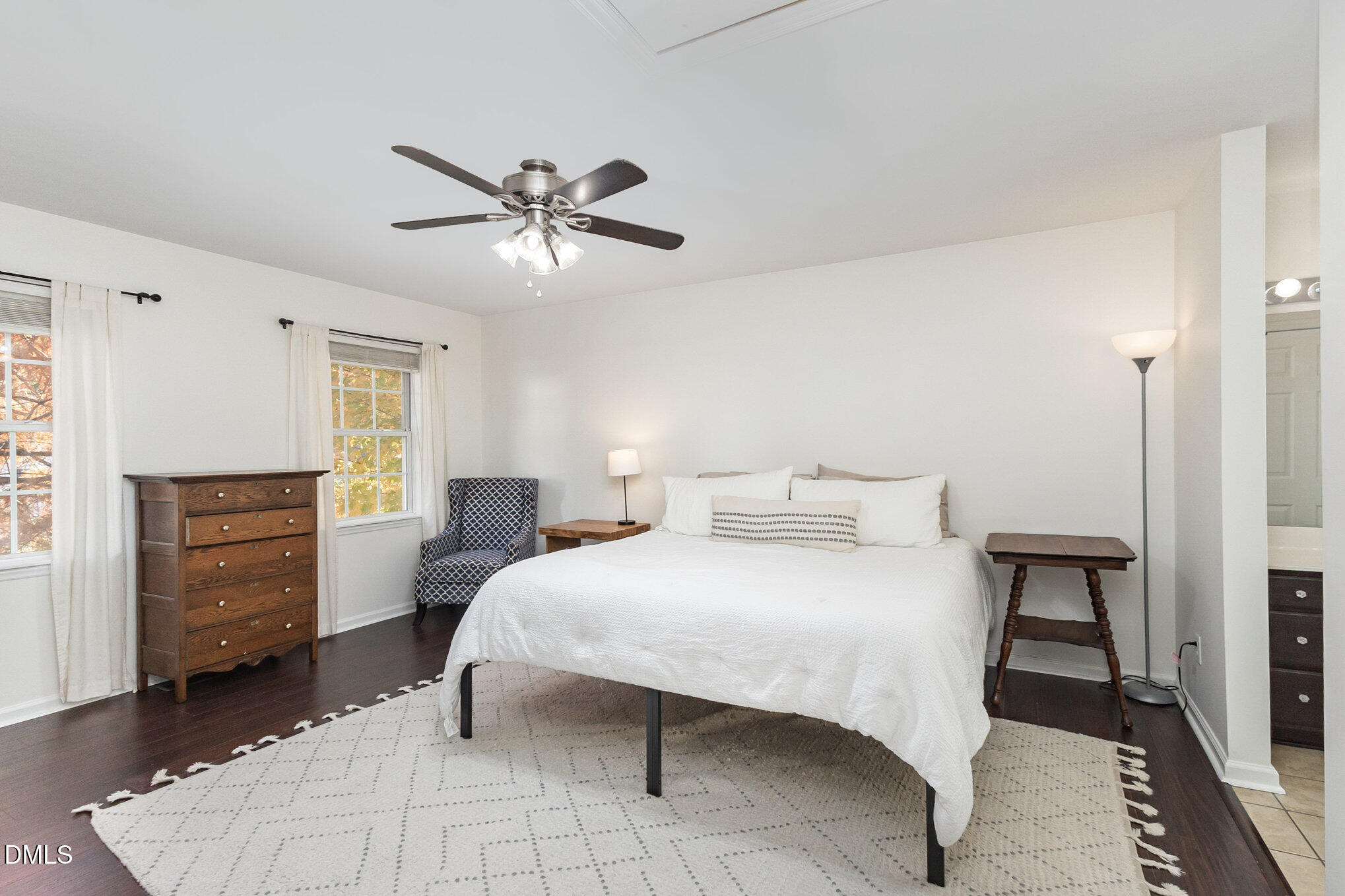 2211 Springhill Avenue Raleigh, NC 27603 - Photo 19 of 42 a bedroom with a bed and a chandelier