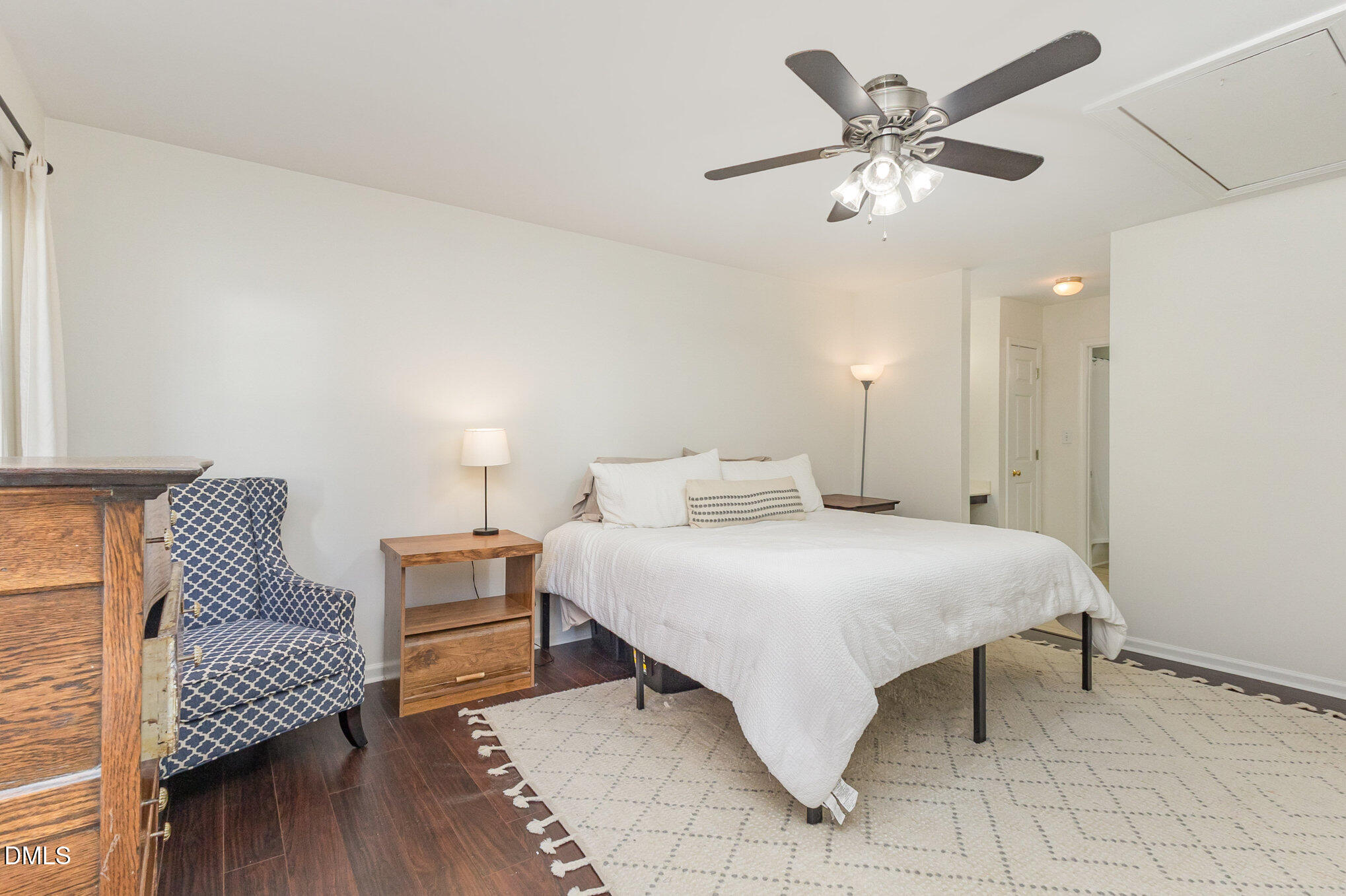 2211 Springhill Avenue Raleigh, NC 27603 - Photo 20 of 42 a spacious bedroom with a bed and a table