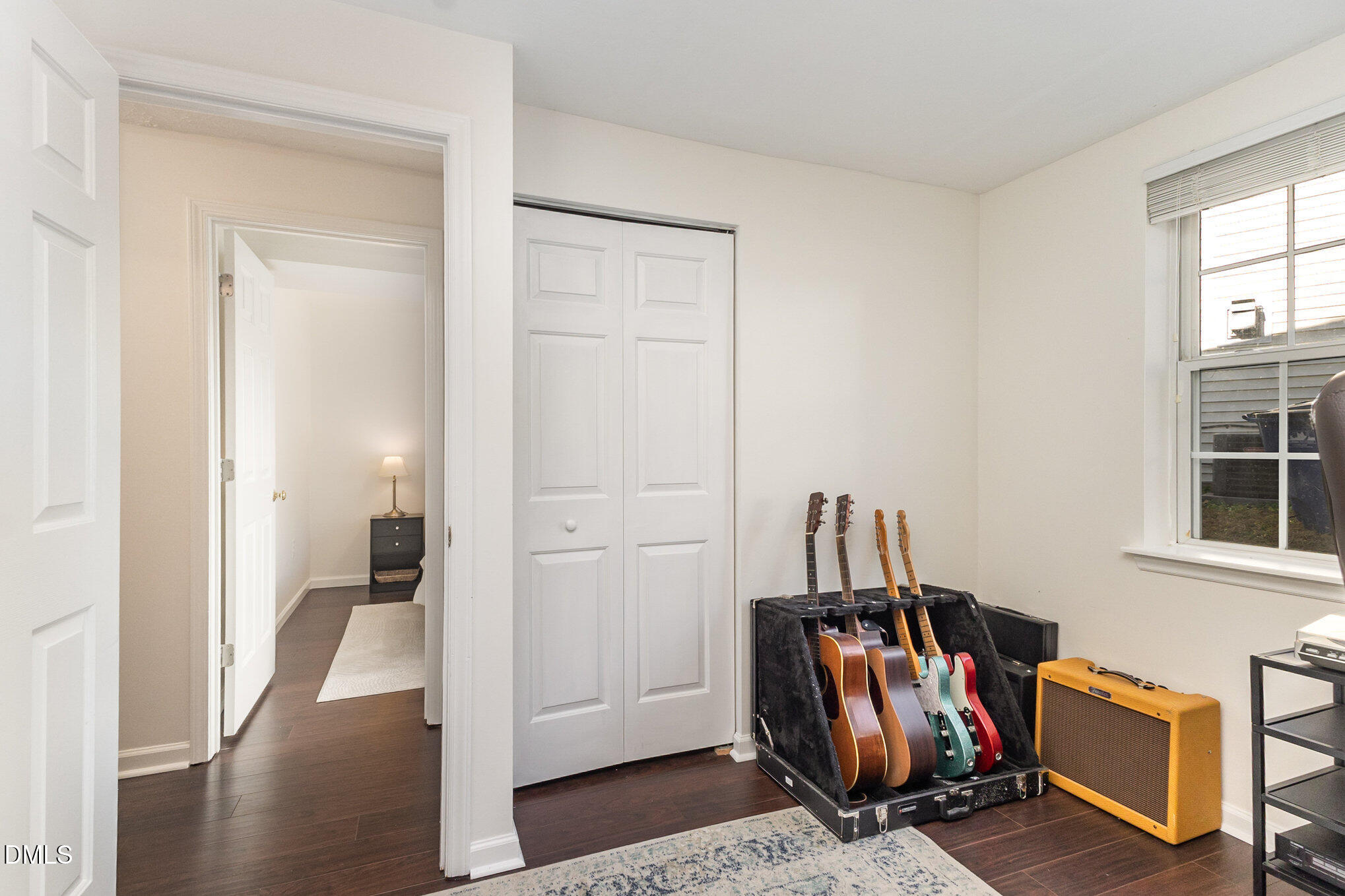 2211 Springhill Avenue Raleigh, NC 27603 - Photo 26 of 42 a view of walk in closet with clothes and shoes