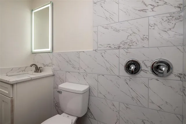 a bathroom with a toilet and sink