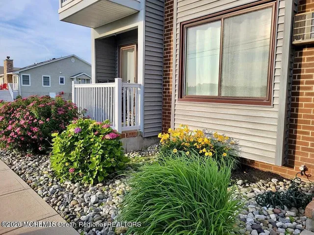 a flower plants in front of a house