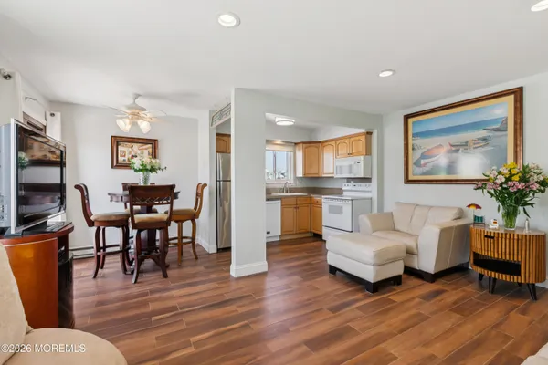 a kitchen with stainless steel appliances granite countertop a refrigerator sink and cabinets
