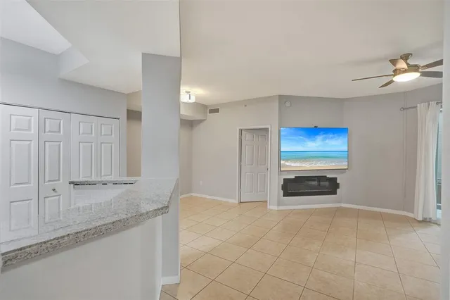 a view of kitchen with refrigerator and window