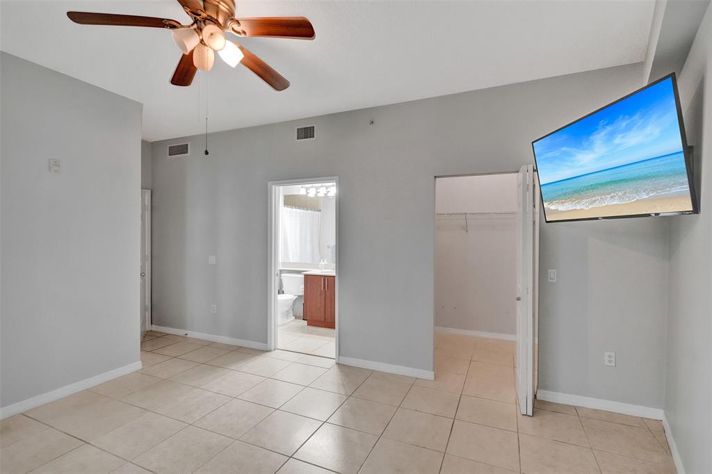 2421 Northeast 65th Street, Unit 2113 Fort Lauderdale, FL 33308 - Photo 17 of 45 a view of an empty room and window