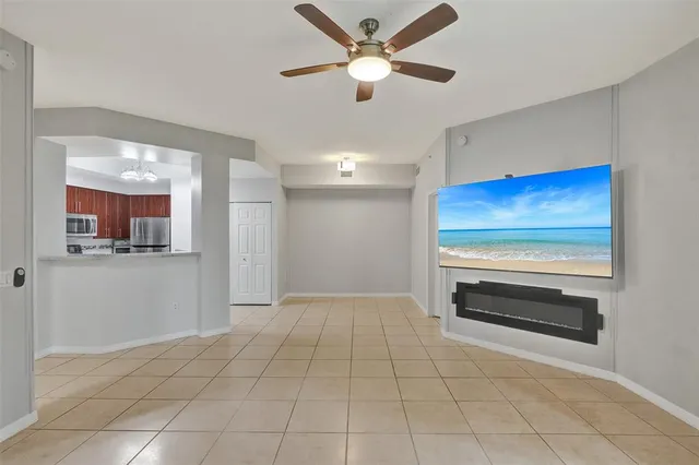 a view of kitchen with furniture and a ceiling fan