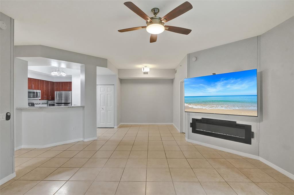 2421 Northeast 65th Street, Unit 2113 Fort Lauderdale, FL 33308 - Photo 2 of 45 a view of kitchen with furniture and a ceiling fan