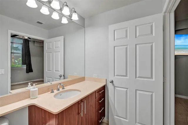 a bathroom with a double vanity sink and a mirror