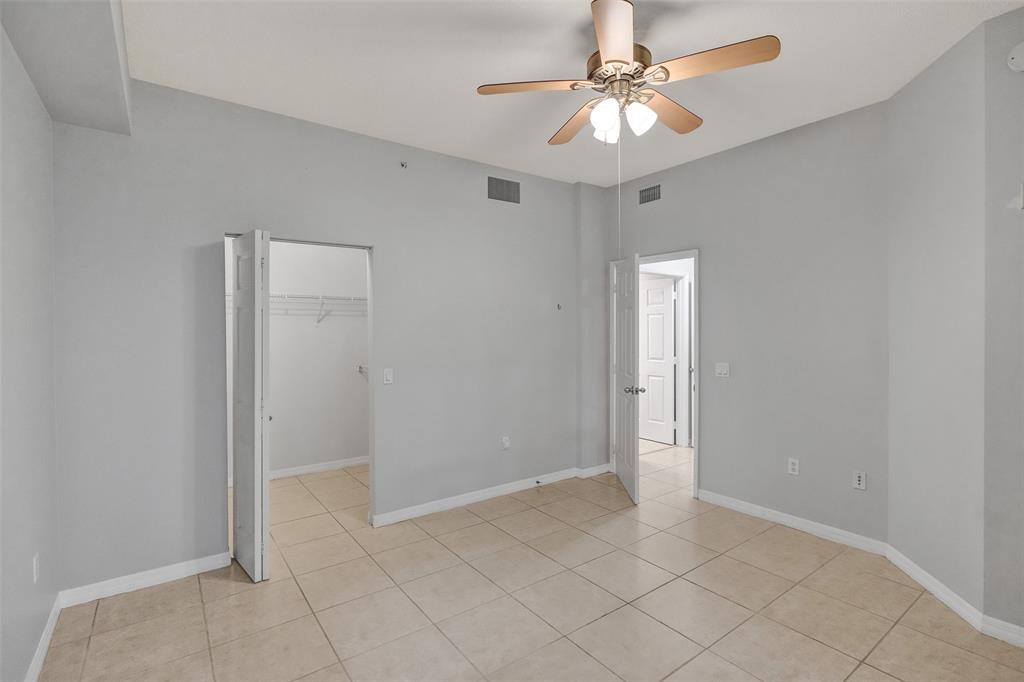 2421 Northeast 65th Street, Unit 2113 Fort Lauderdale, FL 33308 - Photo 26 of 45 an empty room with fan and entryway
