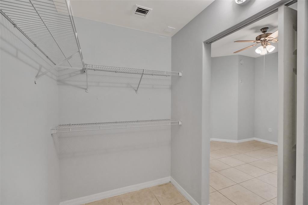 2421 Northeast 65th Street, Unit 2113 Fort Lauderdale, FL 33308 - Photo 29 of 45 a view of a room with racks on the wall