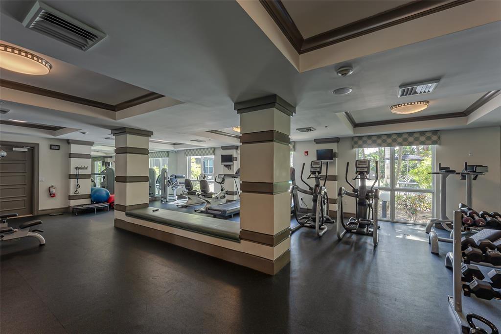 2421 Northeast 65th Street, Unit 2113 Fort Lauderdale, FL 33308 - Photo 38 of 45 a view of a gym room with gym equipment