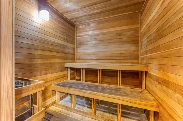 a room with furniture pool table and flat screen tv