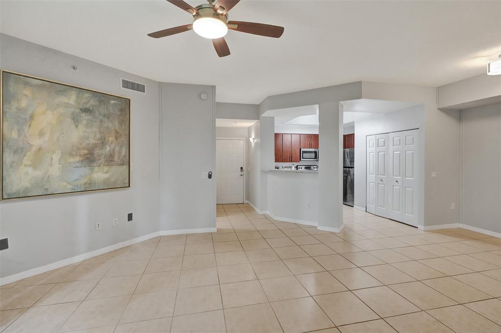 2421 Northeast 65th Street, Unit 2113 Fort Lauderdale, FL 33308 - Photo 9 of 45 a view of a kitchen with a cabinet and a refrigerator cabinets