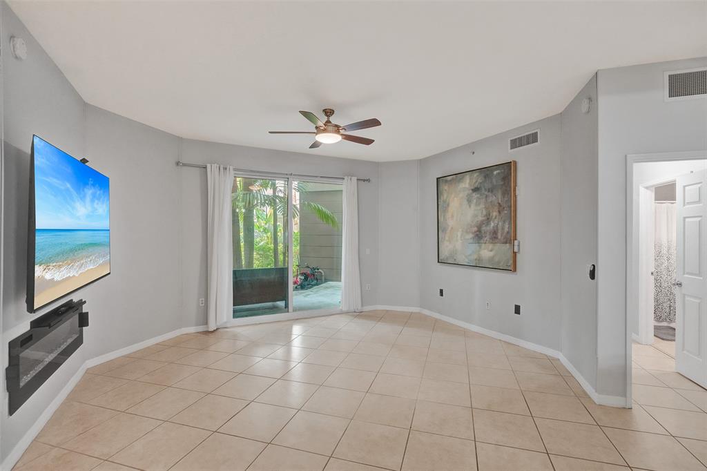2421 Northeast 65th Street, Unit 2113 Fort Lauderdale, FL 33308 - Photo 10 of 45 a view of an empty room with a window