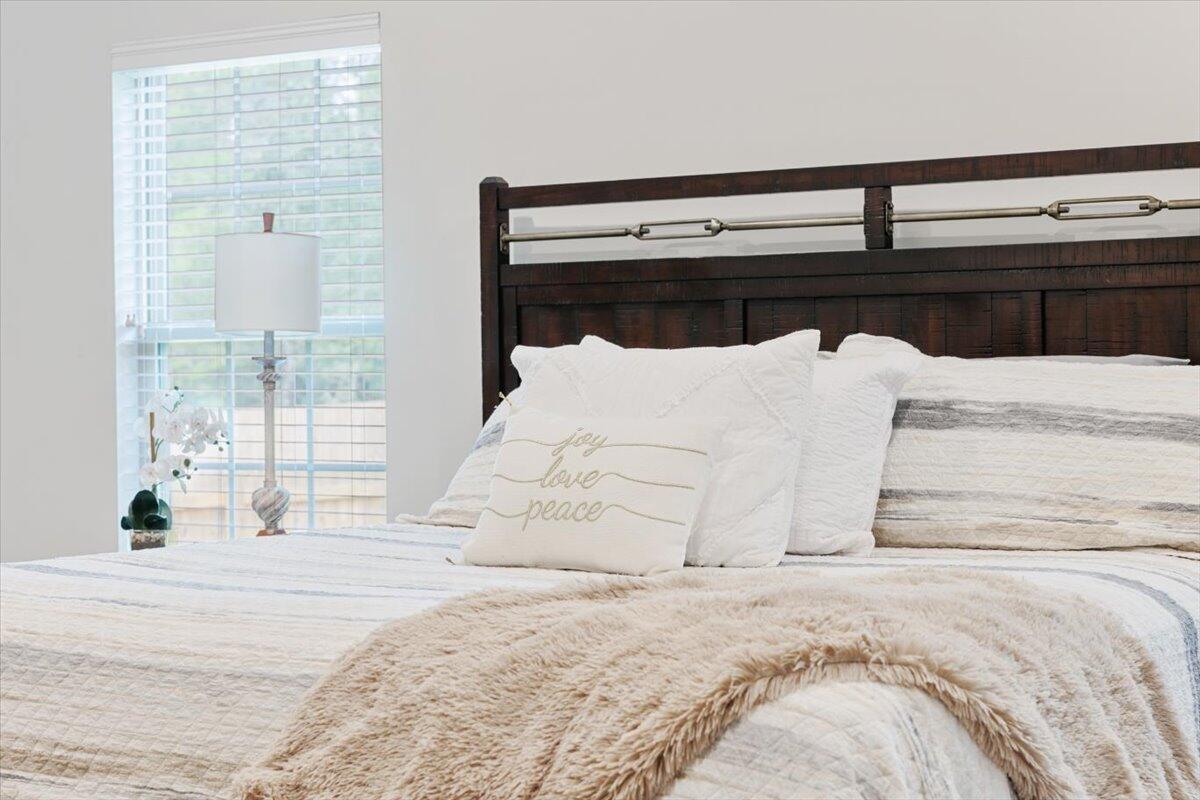 6206 Timberland Ridge Drive Crestview, FL 32539 - Photo 11 of 34 a bed sitting in a bedroom next to a window