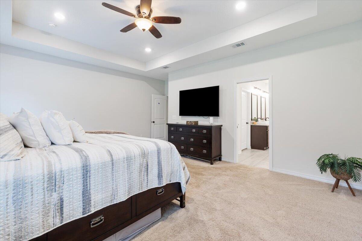 6206 Timberland Ridge Drive Crestview, FL 32539 - Photo 12 of 34 a bedroom with a bed and a flat screen tv