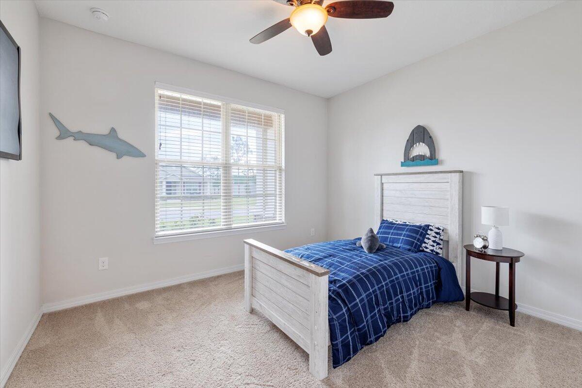 6206 Timberland Ridge Drive Crestview, FL 32539 - Photo 21 of 34 a bedroom with a bed and a window