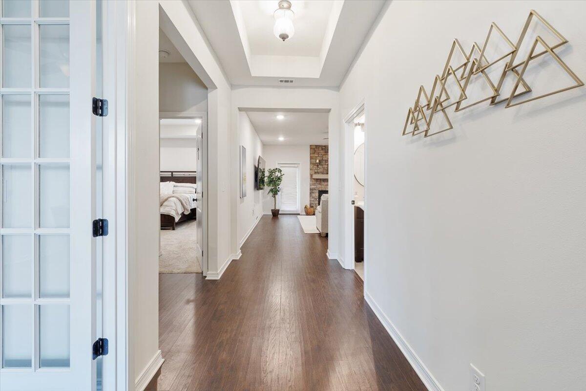 6206 Timberland Ridge Drive Crestview, FL 32539 - Photo 6 of 34 a view of a hallway with wooden floor and staircase