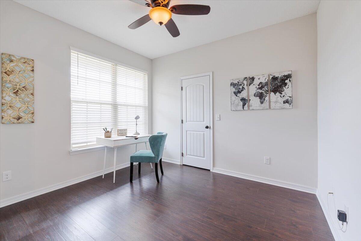 6206 Timberland Ridge Drive Crestview, FL 32539 - Photo 8 of 34 a view of a livingroom with a workspace a window and wooden floor
