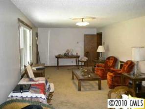 2091 Junction Road Cooleemee, NC 27014 - Photo 6 of 8 a living room with furniture and a fireplace