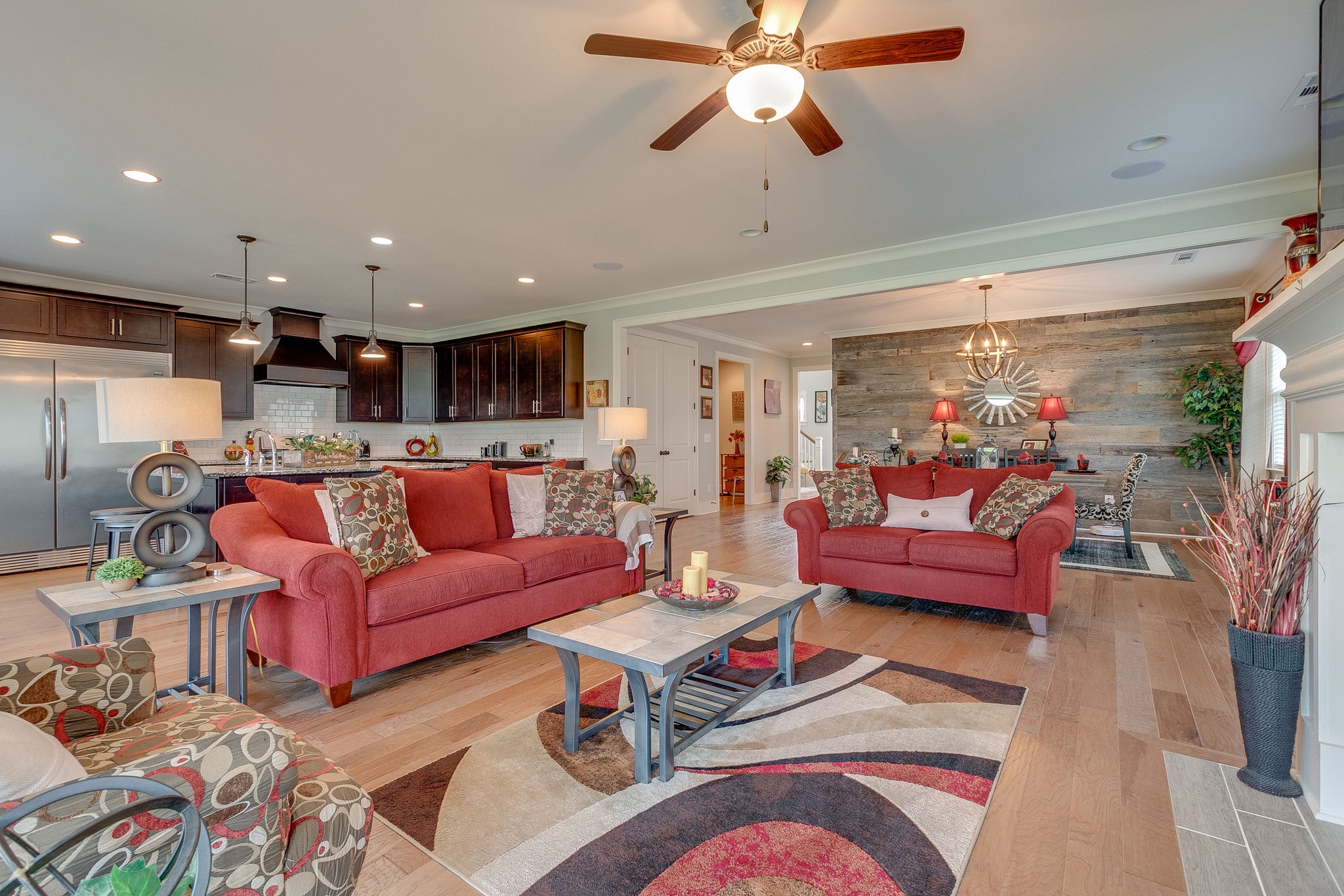 115 Vanner Road Mount Juliet, TN 37122 - Photo 11 of 42 a living room with furniture kitchen view and a chandelier