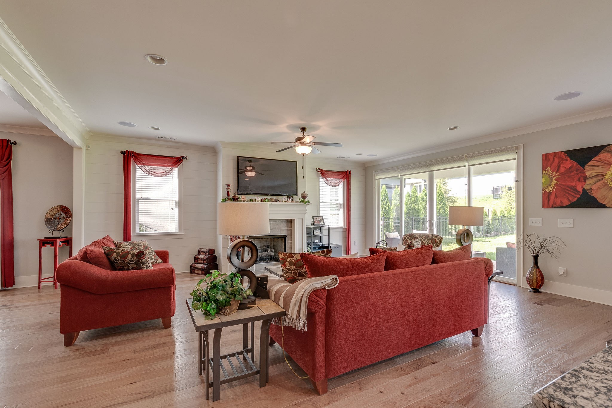 115 Vanner Road Mount Juliet, TN 37122 - Photo 12 of 42 a living room with furniture a fireplace and a flat screen tv