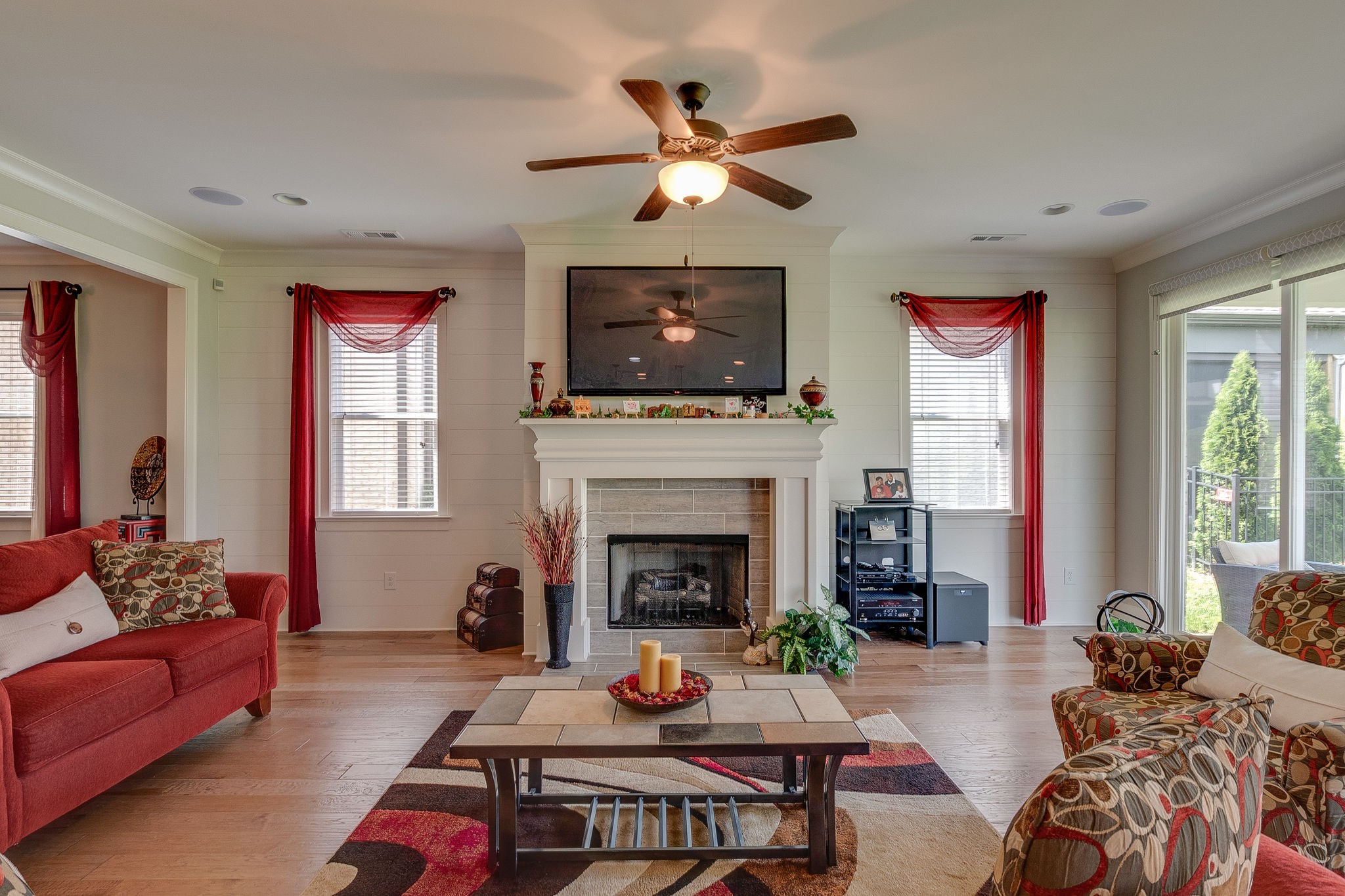 115 Vanner Road Mount Juliet, TN 37122 - Photo 13 of 42 a living room with furniture a flat screen tv and a fireplace