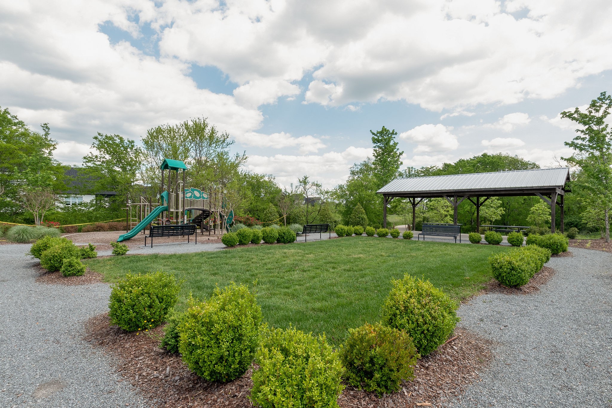 115 Vanner Road Mount Juliet, TN 37122 - Photo 40 of 42 a view of a garden with a bench and trees
