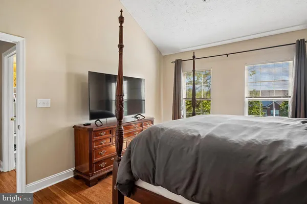 a bedroom with a bed and a view of bathroom